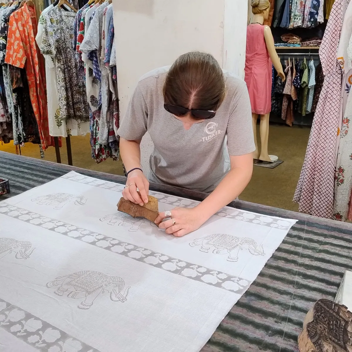 Block printing an elephant motif onto fabric